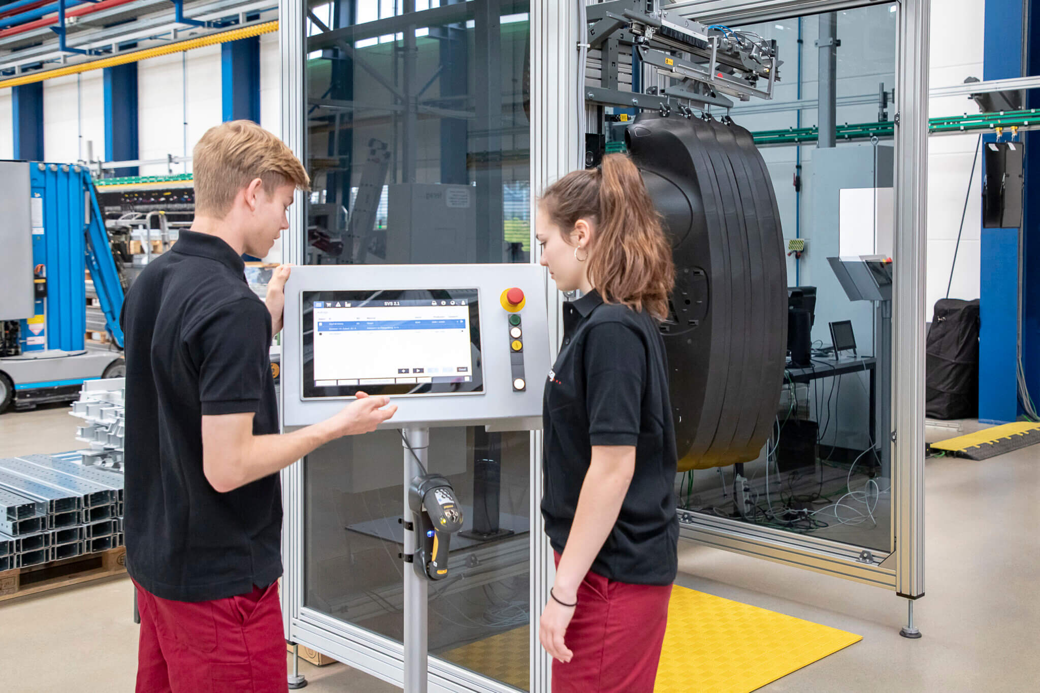 Images of two people operating a machine